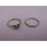 A platinum and diamond solitaire ring and a platinum wedding band, approx total weight 5.1g
