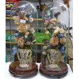 A pair of tall Victorian glass domes with floral s