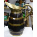 Continental large brass bound coopered oak jug.