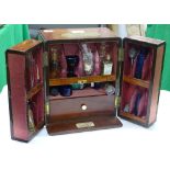 A Victorian mahogany portable chemist's cabinet wi
