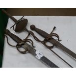 A pair of fencing sabres and an epee.