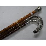 3 Walking canes with silver mounts.