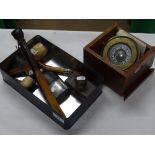 A gimballed compass, spirit flask, desk blotter, e