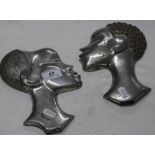 Pair of cast aluminium ethnic heads and a group of