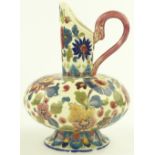 A Zsolnay Pecs ewer jug, hand painted and gilded f