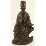 A Chinese patinated bronze seated Buddha on natura