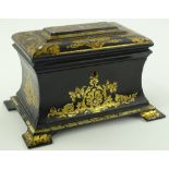 A Victorian papier-mache tea caddy, concave sides