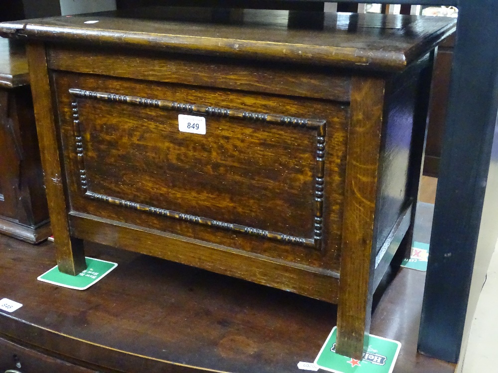 A small panelled oak coffer, width 1'9", height 15