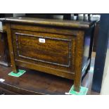 A small panelled oak coffer, width 1'9", height 15