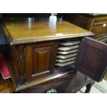 An Edwardian mahogany record cabinet with 2 doors