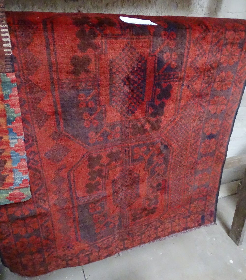 An Antique red ground Balochi rug, 138cm x 86cm.