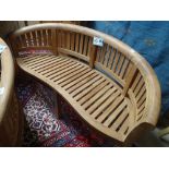 A new Indonesian hardwood bow back garden bench.