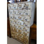 A large Vintage painted metal cabinet with 32 fitt