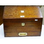 An oak desk top stationery box with drawer under.