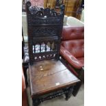 A Victorian oak side chair, with carved panelled a