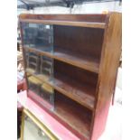 An oak 3-tier bookcase with sliding glazed doors,