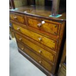 A 19th century polished pine 5-drawer chest with o
