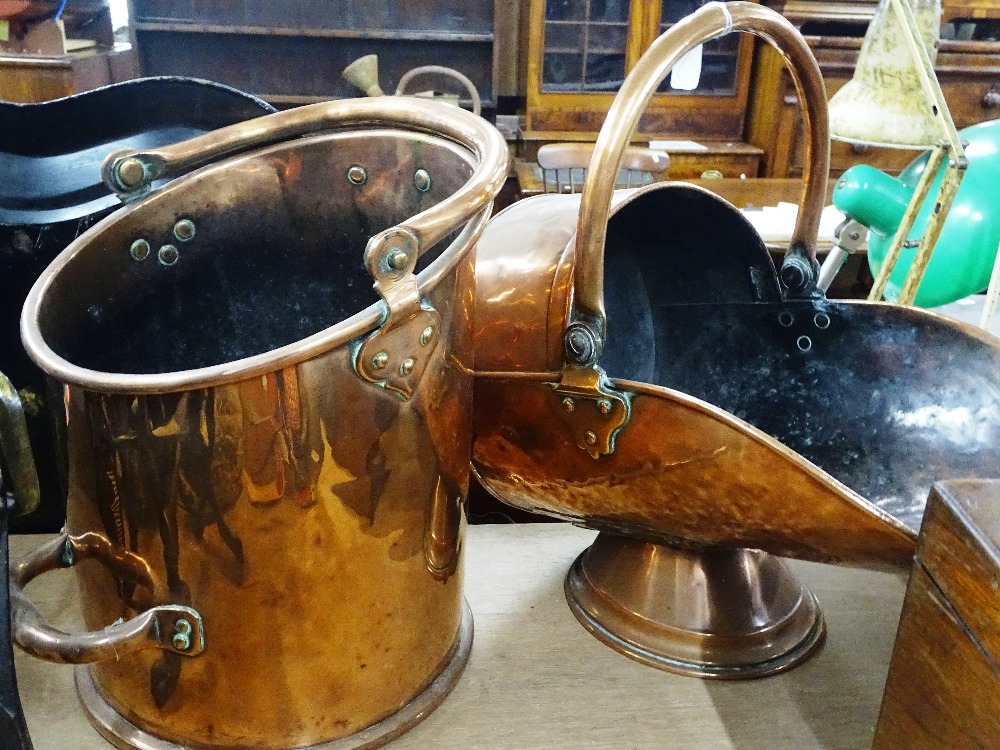 A copper coal bucket and a copper coal scuttle.