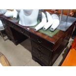 A reproduction mahogany twin pedestal writing desk