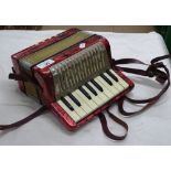 A Hohner small piano accordion.