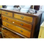 An Edwardian mahogany low 4-drawer chest, on brack