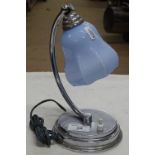 A small Art Deco chrome table lamp with blue glass