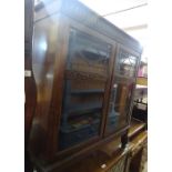 A 1920s oak bookcase with 2 glazed doors, width 2'