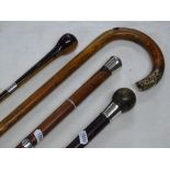 2 Walking canes with silver mounts and 2 others.