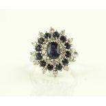 A large 18ct white gold sapphire and diamond clust