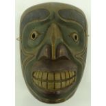 A native North American carved and painted wood ma