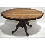 A Victorian rosewood tilt top dining table, with s