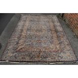 A Persian blue ground floral pattern handmade rug.