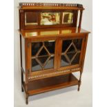 A late Victorian walnut display cabinet with raise