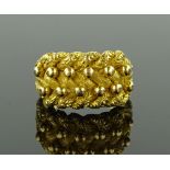 An Edwardian 18ct gold knot design ring, hallmarks