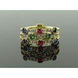 An unmarked gold ruby, emerald, sapphire and diamo