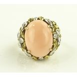 A 14ct gold coral set ring, with diamond set leaf