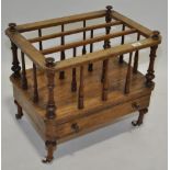 A Victorian walnut Canterbury with single drawer b