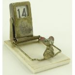 A novelty mousetrap design perpetual desk calendar