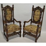 A pair of Carolean style carved oak high back armc