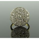 A large 18ct gold diamond cluster ring, total diam