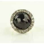 A large 18ct gold facet-cut dome shaped garnet and
