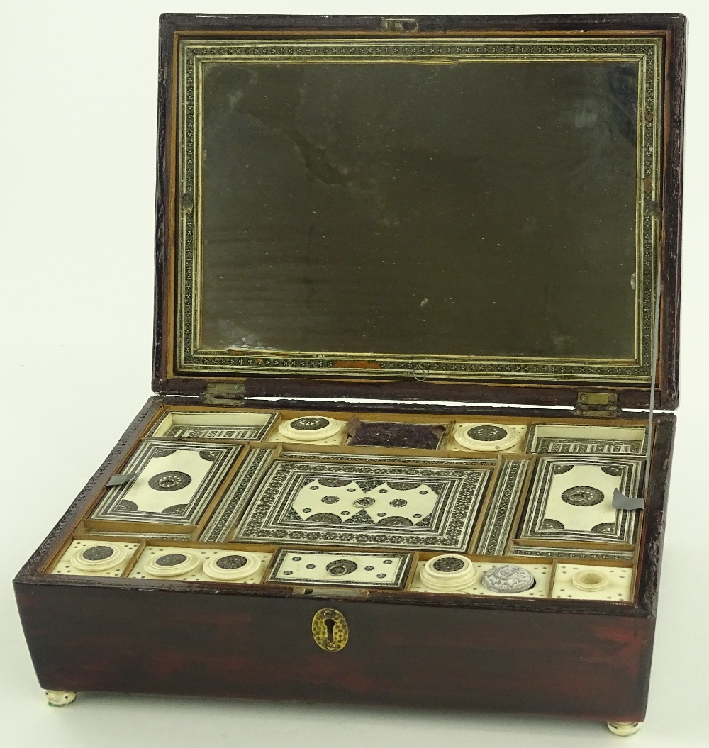 A 19th century Indian vizagapatam work box, staine