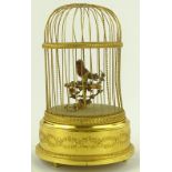 A clockwork automaton tweeting bird in gilded case
