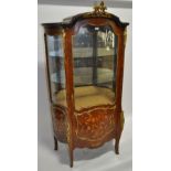 A French Kingwood serpentine front vitrine cabinet