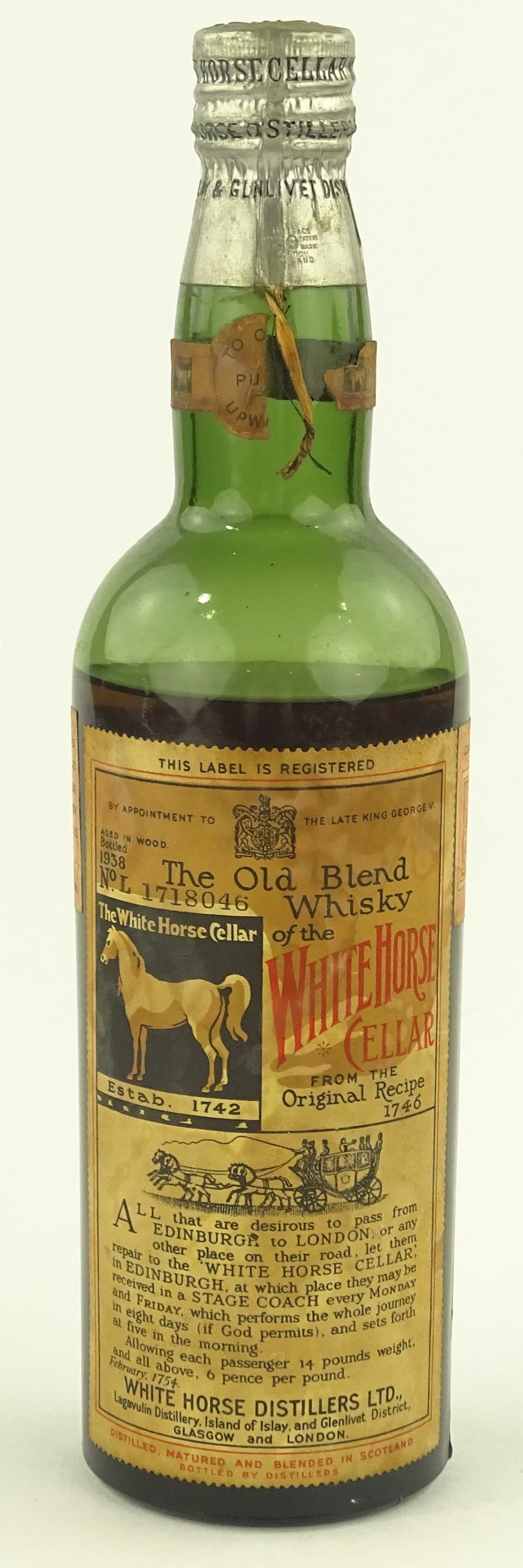 An unopened bottle of White Horse Old Blend Whisky