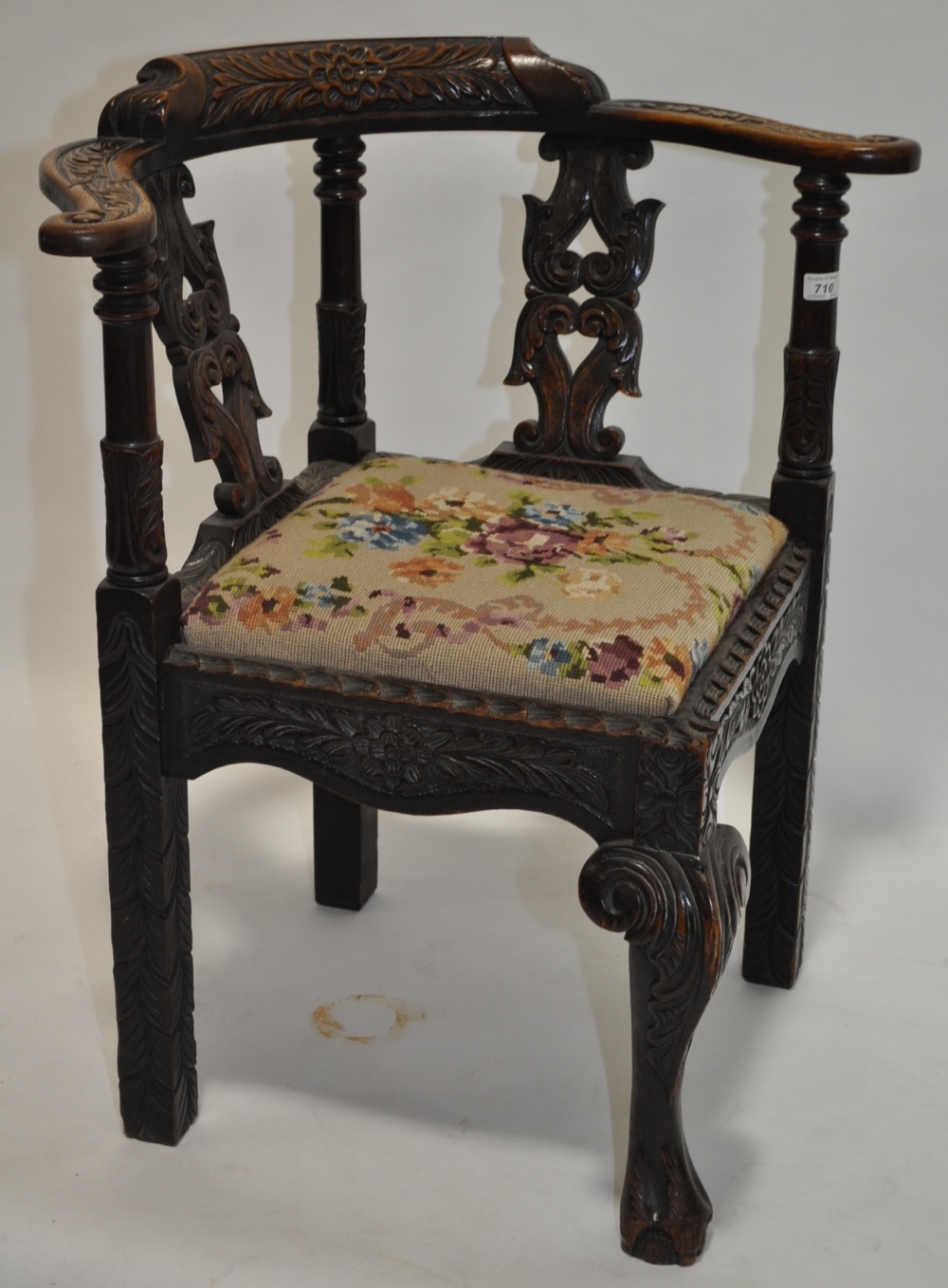 A Victorian carved oak corner chair.