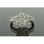 An 18ct white gold diamond cluster ring, total dia