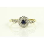 An 18ct gold sapphire and diamond cluster ring, se