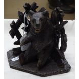A Black Forest carved wood bear.