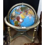 A stone set terrestrial globe in gimballed tabletop